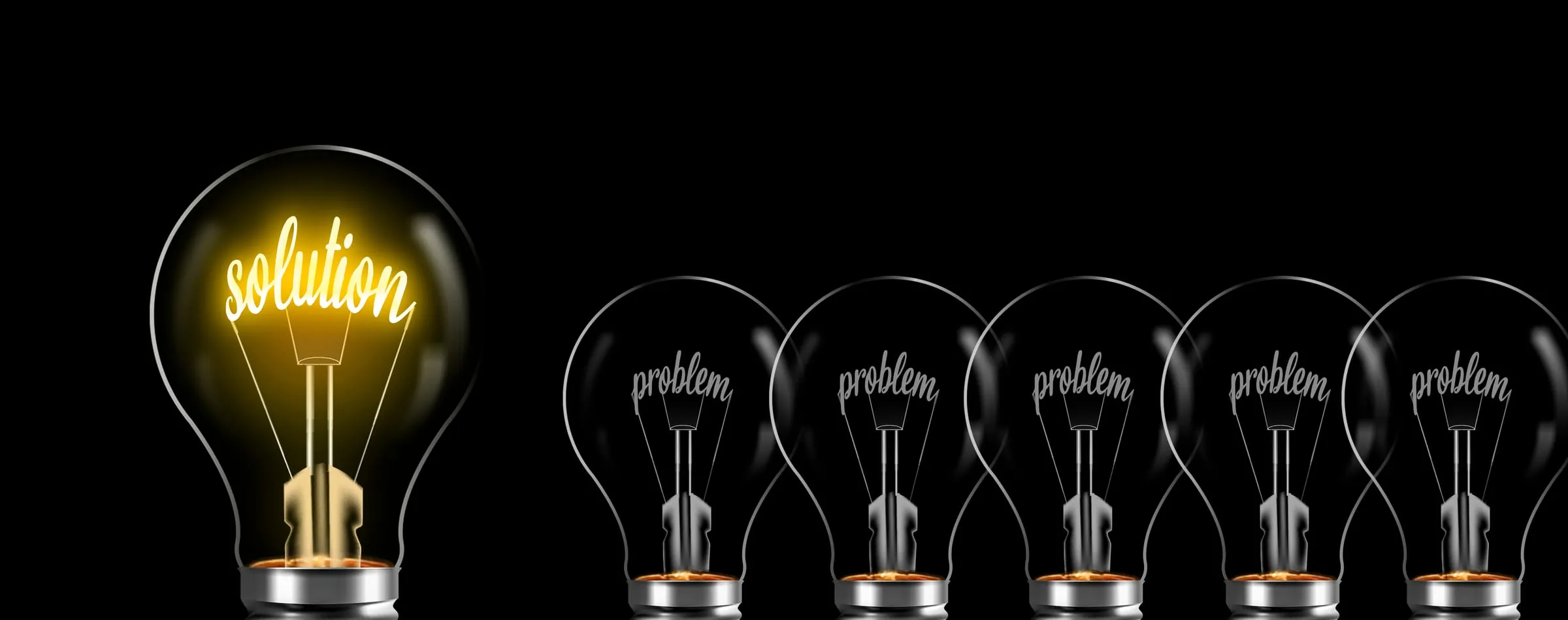 One lit bulb reading 'solution' beside unlit bulbs reading 'problem'